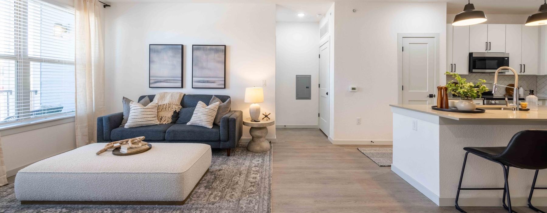 a large living room with a couch and a table